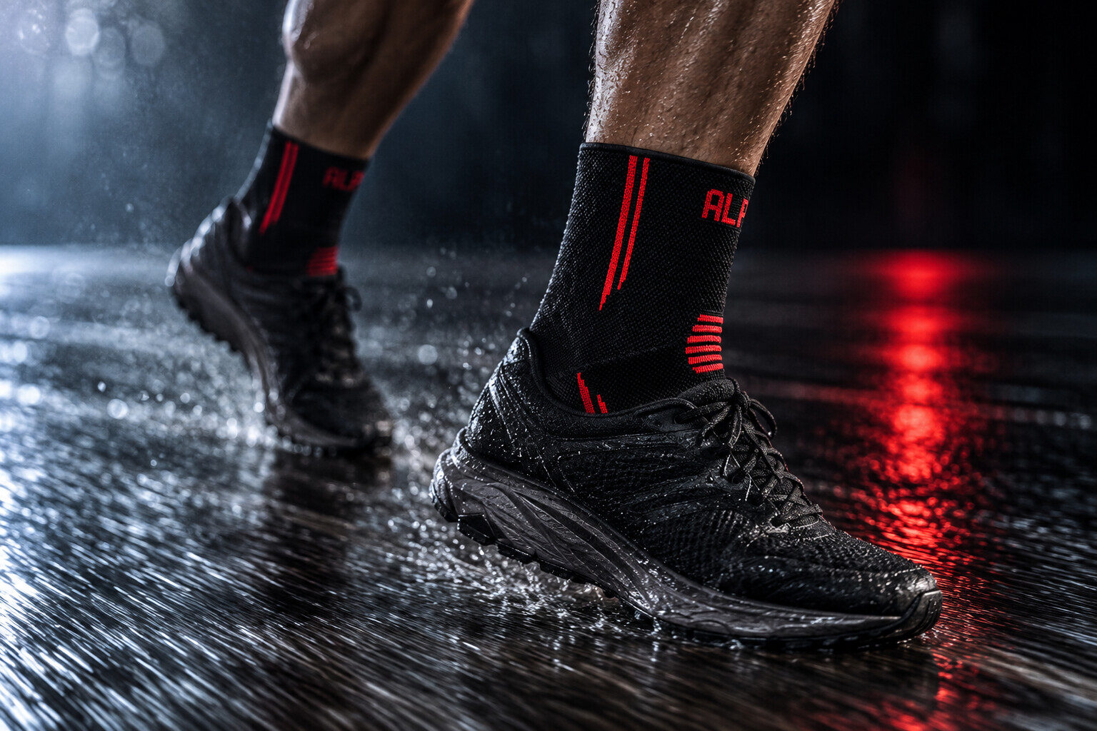 Rain on a dark gym floor, red light reflecting