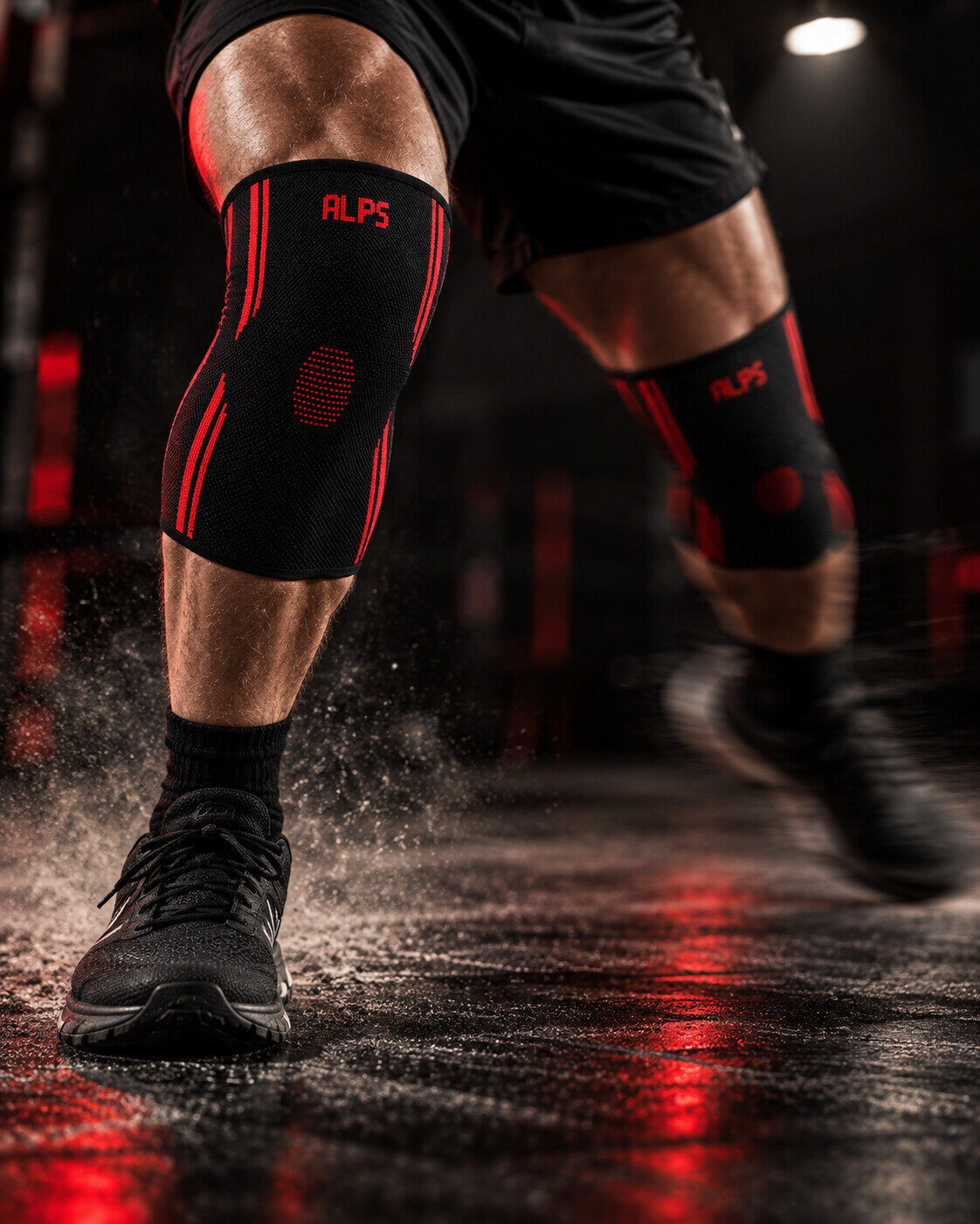 Legs in motion on a wet gym floor under red light