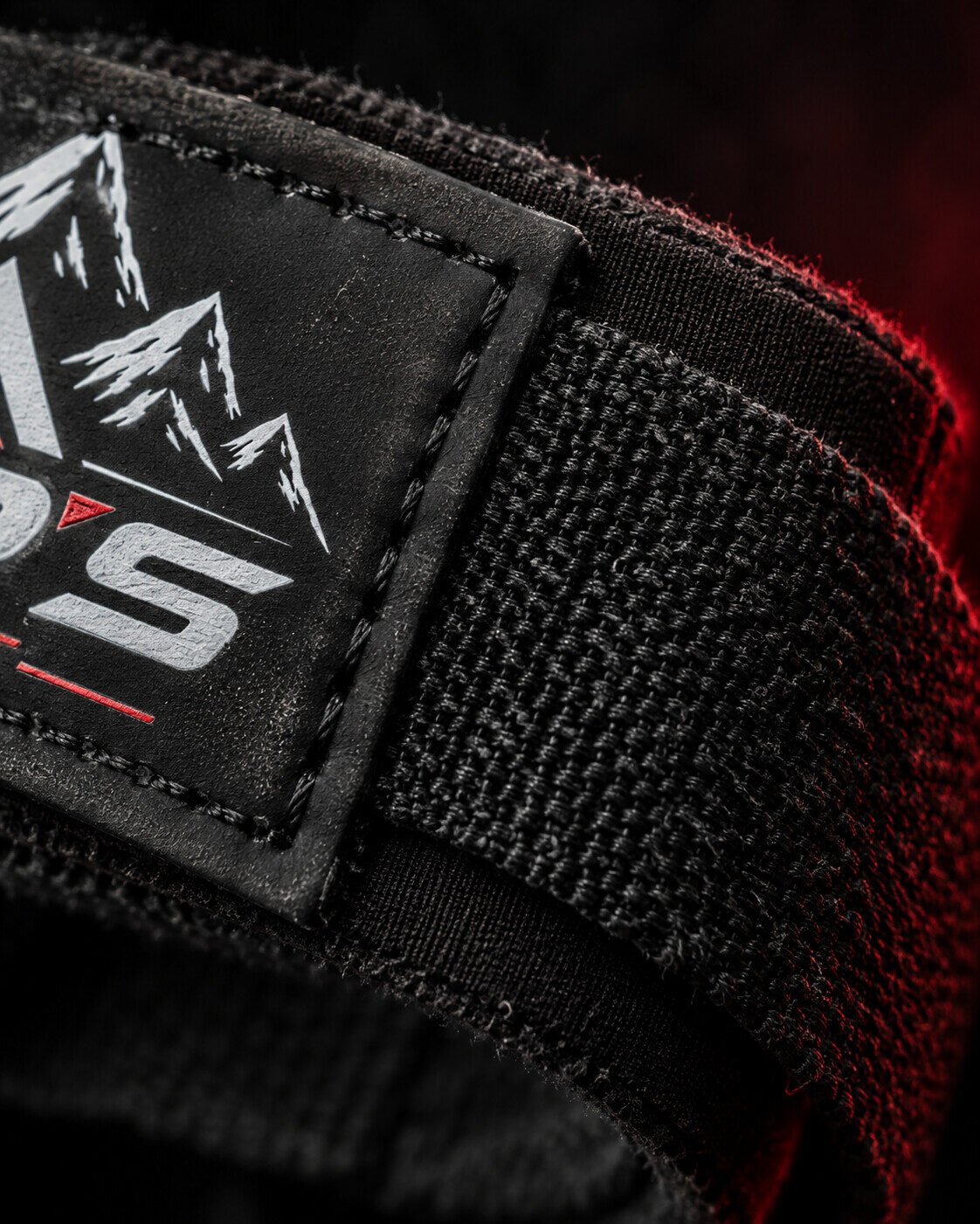 A stitched fabric patch with red backlight